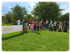 Photo of queue for donkeys with Prospect Hospice Banner