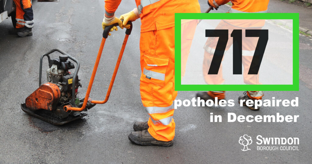 Worker repairing pothole.