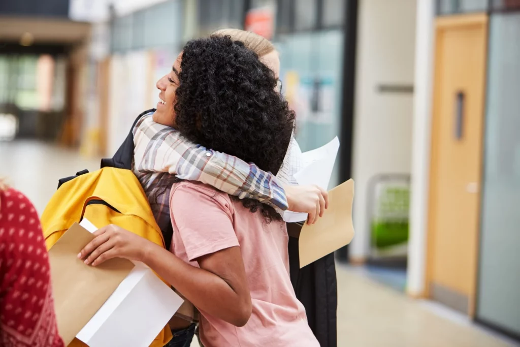 Hugging students